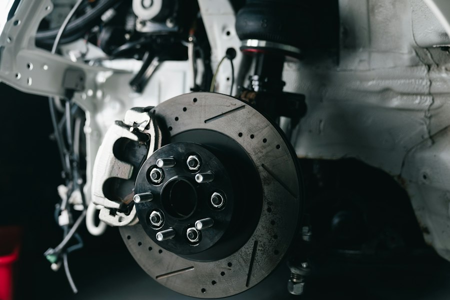 Close-up of a drilled brake rotor and caliper on a vehicle